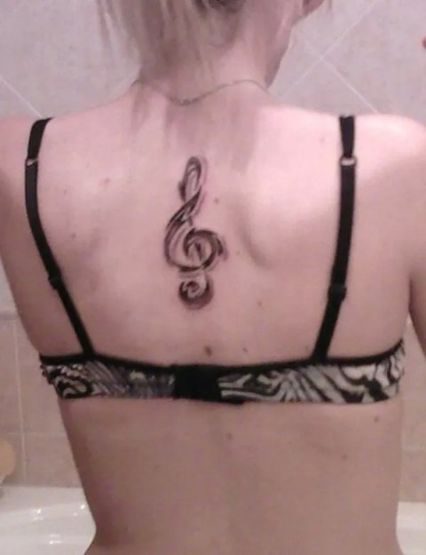 Alessandra - Tribal music: real inked placement tattoo photo thumbnail
