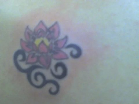 Amber - Tribal lotus: real inked placement tattoo photo thumbnail