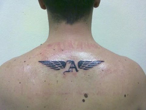 Andrea - Winged A: real inked placement tattoo photo thumbnail