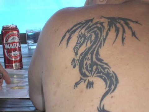 Bartek - tribal dragon: real inked placement tattoo photo thumbnail