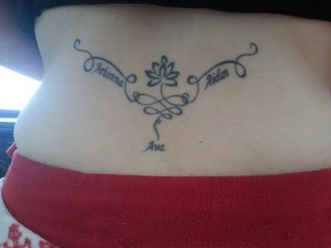 Dionne - lotus lowerback: real inked placement tattoo photo thumbnail
