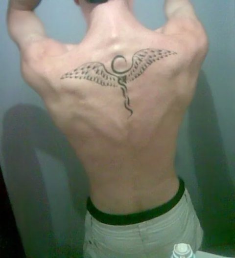 Giordano - Winged Ankh: real inked placement tattoo photo thumbnail