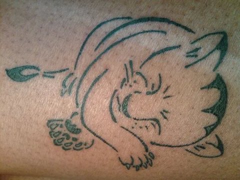 Kenya - Sleeping lion cub: real inked placement tattoo photo thumbnail