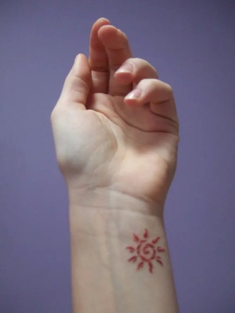 Neringa - Fire sun: real inked placement tattoo photo thumbnail
