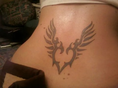 Rosaria - Tribal winged heart: real inked placement tattoo photo thumbnail