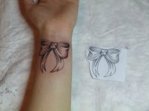 Stefania - Bow: real inked placement tattoo photo thumbnail